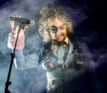 Watch The Flaming Lips perform inside giant bubbles in ‘Dinosaurs On The Mountain’ video