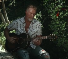 Watch Josh Homme perform Them Crooked Vultures’ ‘Spinning in Daffodils’ acoustic for Lollapalooza