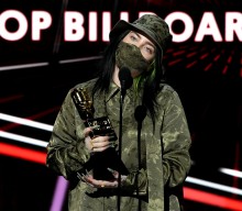 Billie Eilish urges fans to “please vote and wear a mask” while accepting Billboard Music award
