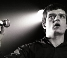 Ian Curtis mural unveiled in Manchester by Peter Hook