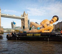 A 40-foot inflatable Borat statue floated down the River Thames today