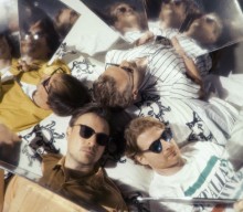 Django Django announce deluxe edition of ‘Glowing In The Dark’ with new song ‘Under Fire’