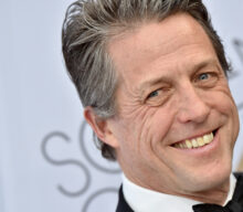Hugh Grant says COVID-19 symptoms made him “want to sniff strangers’ armpits”
