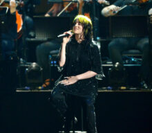 Billie Eilish says the mixed reaction to her ‘No Time To Die’ theme song announcement was “rough”