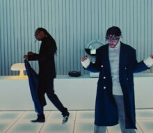 Watch Bad Bunny journey through the desert to a menswear shop in ‘Hoy Cobré’ video
