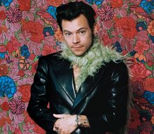 Harry Styles spotted filming music video on giant bed outside Buckingham Palace