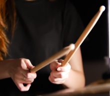 Watch bride play drum solo at wedding in specially modified dress