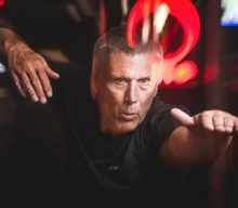 Listen to Happy Mondays’ Bez make vocal debut on psychedelic banger ‘Flying Bus’