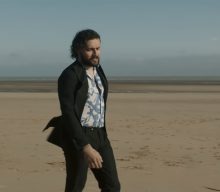 Watch Gang Of Youths perform on the beach in ‘Unison’ music video