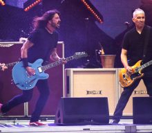 Watch Foo Fighters invite fan on stage in Kansas to play ‘Monkey Wrench’