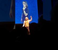 Watch IRON MAIDEN’s BRUCE DICKINSON Sing A Cappella Version Of ‘The Writing On The Wall’ In London
