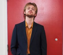 Finneas opens up about the “surreal” feeling of singing with Coldplay