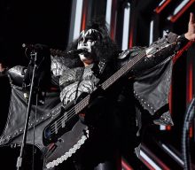 Watch Gene Simmons avoid fall after descending platform malfunctions during KISS gig