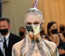 Grimes says she staged photo to trick paparazzi following her