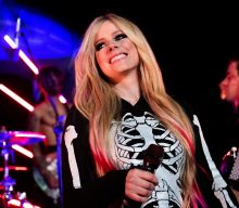 Avril Lavigne signs to Travis Barker’s record label and teases new single
