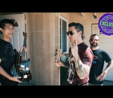 AVENGED SEVENFOLD’s SYNYSTER GATES And JOHNNY CHRIST Surprise Fan With Signed Guitar (Video)