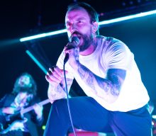 Idles “visualise monotony hell” in bizarre ‘Stockholm Syndrome’ video