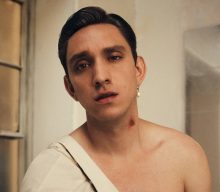 Oliver Sim pays homage to film “villains and heroes” on new single ‘Run The Credits’