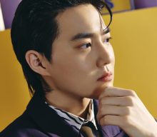 EXO’s Suho freezes time in cinematic ‘Grey Suit’ music video