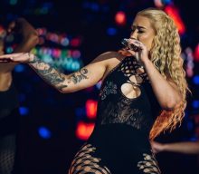 Iggy Azalea promises new music and “scandalous shit”