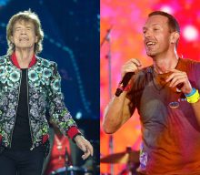 Here’s Mick Jagger enjoying a “busman’s holiday” watching Coldplay