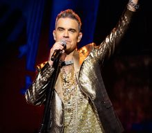 Robbie Williams forced to remove “four asshole villains” from biopic movie script